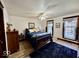 Comfortable bedroom featuring a blue comforter, hardwood floors, and natural light at 155 Boring Pl, Martinsville, IN 46151