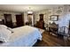 This bedroom features period wallpaper, hard wood floors and vintage furnishings at 155 Boring Pl, Martinsville, IN 46151