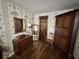 Bedroom boasting historic wallpaper, wood floors, and antique furniture at 155 Boring Pl, Martinsville, IN 46151