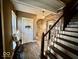 Entryway features wooden floors, neutral decor, and a staircase leading to the upper level of the home at 155 Boring Pl, Martinsville, IN 46151