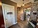 Charming entryway with brick accent wall and view into the dining area at 155 Boring Pl, Martinsville, IN 46151