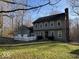 Inviting two-story home with manicured lawn, white picket fence, and mature trees, offering curb appeal at 155 Boring Pl, Martinsville, IN 46151