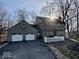 Beautiful home with an attached garage, driveway, green lawn, and mature trees, all nestled in a cul-de-sac at 155 Boring Pl, Martinsville, IN 46151