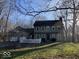 Beautiful home with green lawn and mature trees, showcasing its classic architecture and curb appeal at 155 Boring Pl, Martinsville, IN 46151