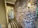 Charming hallway featuring an exposed brick wall with historical detail, and access to other rooms at 155 Boring Pl, Martinsville, IN 46151