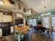 Unique eat-in kitchen features exposed brick, decorative touches, hardwood floors, and a vintage-style design at 155 Boring Pl, Martinsville, IN 46151