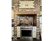 Kitchen area with stainless steel appliances, exposed brick accents, and a sleek range oven at 155 Boring Pl, Martinsville, IN 46151