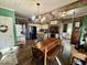 Spacious country kitchen with brick accents, island, and dining area at 155 Boring Pl, Martinsville, IN 46151