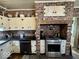 Kitchen showcasing brick accents, modern appliances, and ample counter space at 155 Boring Pl, Martinsville, IN 46151