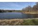 Scenic view of the lake surrounded by trees and grassy shoreline at 155 Boring Pl, Martinsville, IN 46151