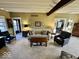 Open concept living room with comfortable seating, fireplace and natural light at 155 Boring Pl, Martinsville, IN 46151