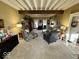 Comfortable living room features neutral carpet, a brick fireplace, and charming decor at 155 Boring Pl, Martinsville, IN 46151