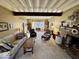 Spacious living room features exposed ceiling beams, fireplace, and ample seating at 155 Boring Pl, Martinsville, IN 46151