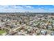Wide aerial view showing a residential neighborhood with a distant city skyline at 1715 E Kelly St, Indianapolis, IN 46203