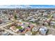 Expansive aerial view of neighborhood homes with a city skyline in the distance on a sunny day at 1715 E Kelly St, Indianapolis, IN 46203