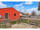 Wooden back deck overlooking backyard with a view of the exterior of the home at 1715 E Kelly St, Indianapolis, IN 46203