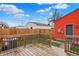 Wooden back deck showing a fenced yard and the exterior of the home at 1715 E Kelly St, Indianapolis, IN 46203