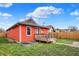 Backyard featuring a cozy deck, lush lawn, and modern garden beds for gardening at 1715 E Kelly St, Indianapolis, IN 46203