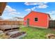 Backyard featuring a wooden deck, metal garden beds, and vinyl siding at 1715 E Kelly St, Indianapolis, IN 46203