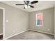 Bedroom featuring neutral walls, carpet, a ceiling fan, and a window at 1715 E Kelly St, Indianapolis, IN 46203