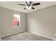 Neutral bedroom with a window allowing natural light and a ceiling fan at 1715 E Kelly St, Indianapolis, IN 46203