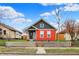 Charming home featuring a well-kept front yard and a colorful two-tone exterior at 1715 E Kelly St, Indianapolis, IN 46203