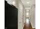 Hallway with wood floors connects rooms in the home at 1715 E Kelly St, Indianapolis, IN 46203