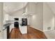 Kitchen features a modern island, white cabinets, black countertops, and stainless steel appliances at 1715 E Kelly St, Indianapolis, IN 46203