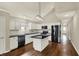 Kitchen features a modern island, white cabinets, black countertops, and stainless steel appliances at 1715 E Kelly St, Indianapolis, IN 46203