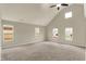 Bright, carpeted living room with vaulted ceilings and ample natural light at 1715 E Kelly St, Indianapolis, IN 46203