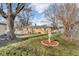 Backyard showing large trees and lawn area, also features a bird bath and fence at 1731 N Campbell Ave, Indianapolis, IN 46218