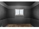 Neutral bedroom offers a window with horizontal blinds and a closet with sliding door at 1731 N Campbell Ave, Indianapolis, IN 46218