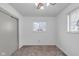 Bright bedroom with neutral carpet, closet, and natural light through window at 1731 N Campbell Ave, Indianapolis, IN 46218