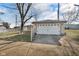 Detached garage with driveway and chain link fence at 1731 N Campbell Ave, Indianapolis, IN 46218