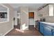 An inviting view of the kitchen with laundry area access, featuring laminate flooring at 1731 N Campbell Ave, Indianapolis, IN 46218