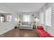 Bright living room with modern decor, laminate floors and large windows that provide natural light at 1731 N Campbell Ave, Indianapolis, IN 46218