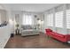 Bright living room with modern decor, laminate floors and large windows that provide natural light at 1731 N Campbell Ave, Indianapolis, IN 46218