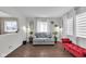 Bright living room with modern decor, laminate floors and large windows that provide natural light at 1731 N Campbell Ave, Indianapolis, IN 46218