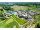 Community aerial view featuring a clubhouse, pool, golf course and tennis courts at 20147 Chad Hittle Blvd, Westfield, IN 46074