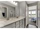 Modern bathroom vanity features double sinks, quartz countertop, and designer fixtures at 20147 Chad Hittle Blvd, Westfield, IN 46074