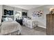 Comfortable bedroom features twin beds, soft bedding, stylish decor, and plenty of light at 20147 Chad Hittle Blvd, Westfield, IN 46074