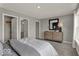 Light and airy bedroom featuring a dresser, mirror and closet access for optimal storage at 20147 Chad Hittle Blvd, Westfield, IN 46074