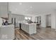 Spacious kitchen island with seating, stainless appliances, and adjoining dining area at 20147 Chad Hittle Blvd, Westfield, IN 46074
