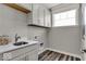 Convenient laundry room equipped with a sink, countertop, and cabinetry for storage and functionality at 20147 Chad Hittle Blvd, Westfield, IN 46074