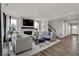 Elegant living room featuring a fireplace, large TV, and stylish gray furniture set at 20147 Chad Hittle Blvd, Westfield, IN 46074