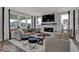 Bright and airy living room featuring neutral decor, large windows, and a cozy fireplace at 20147 Chad Hittle Blvd, Westfield, IN 46074