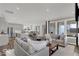 Bright open layout showcasing the living room, kitchen, and dining area with large windows at 20147 Chad Hittle Blvd, Westfield, IN 46074