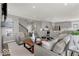 Open-concept living room and kitchen with gray decor and stainless steel appliances at 20147 Chad Hittle Blvd, Westfield, IN 46074
