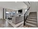 Spacious living room with a modern fireplace, large windows, and comfortable seating at 20147 Chad Hittle Blvd, Westfield, IN 46074