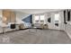 Stylish living room features neutral tones, plush furniture, and natural light from large windows at 20147 Chad Hittle Blvd, Westfield, IN 46074